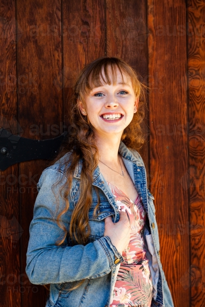 Portrait of a smiling young woman in her late teens - Australian Stock Image