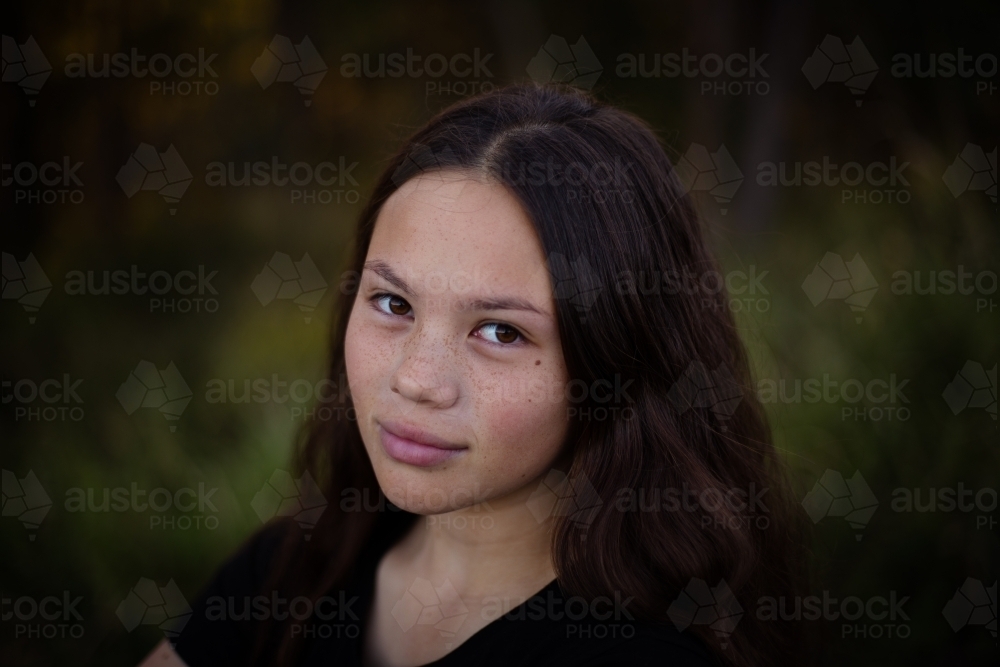 Image of Portrait of a teen girl outside - Austockphoto