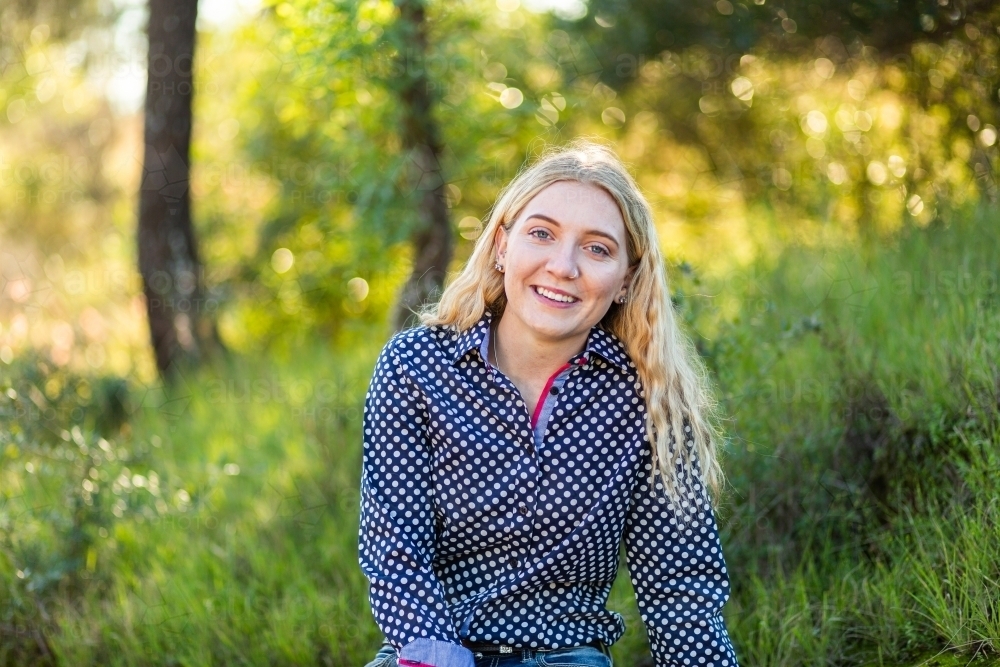 Portrait of a woman on green grass - Australian Stock Image