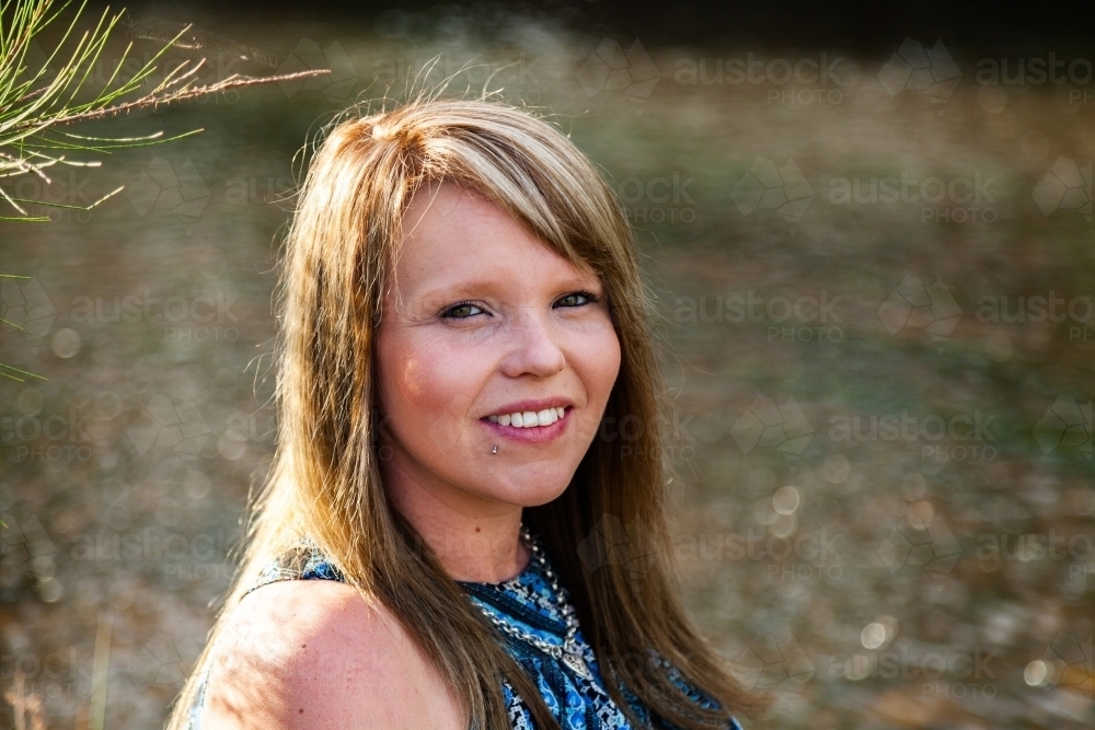 Portrait of a woman outside beside water - Australian Stock Image