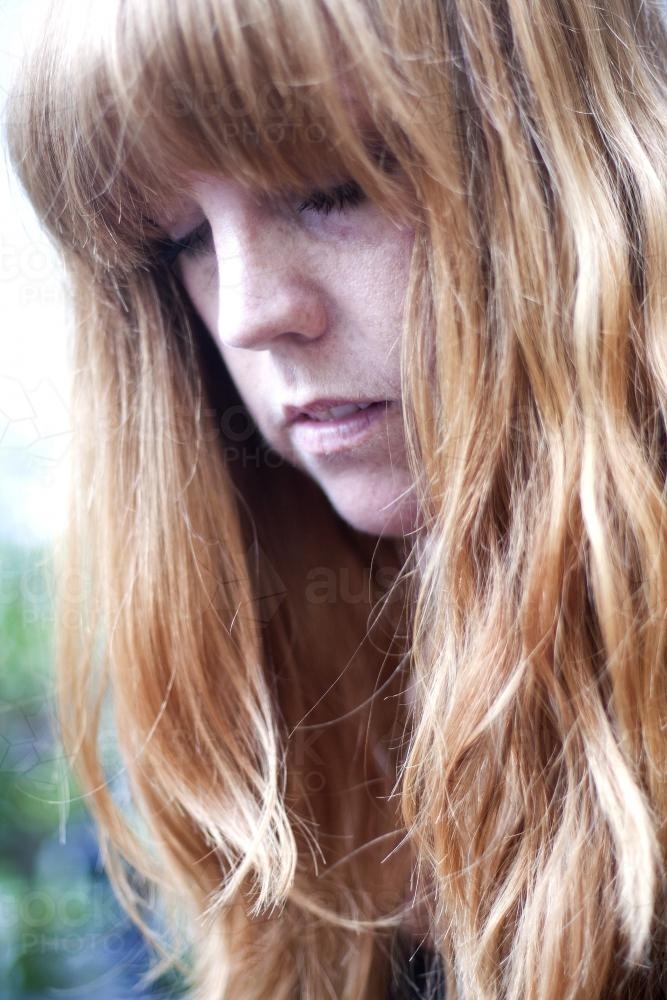Portrait of a woman with red hair - Australian Stock Image