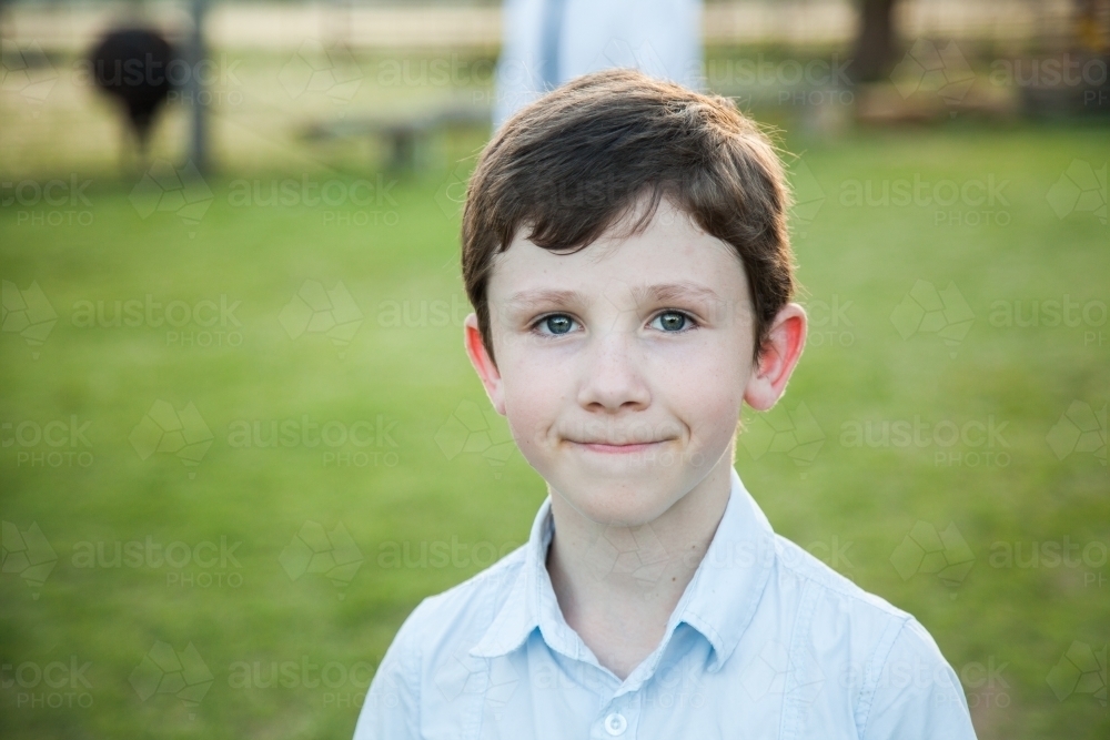 preteen 9yo Image of Portrait of a young 9yo boy outside - Austockphoto