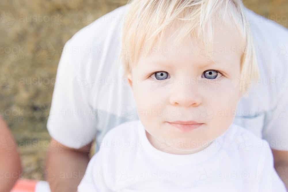 Portrait of a young blonde boy with blue eyes - Australian Stock Image