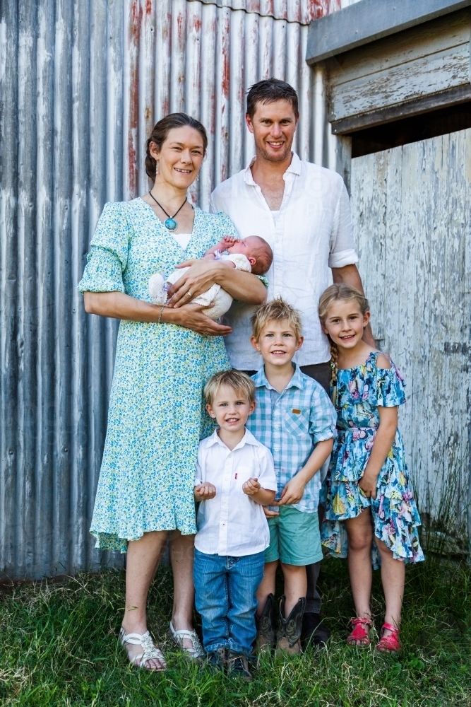 portrait of a young family with four children - Australian Stock Image