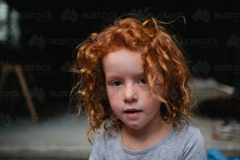 Portrait of a young girl looking at the camera - Australian Stock Image