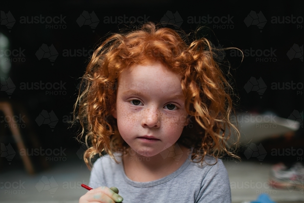 Portrait of a young girl with a serious expression - Australian Stock Image
