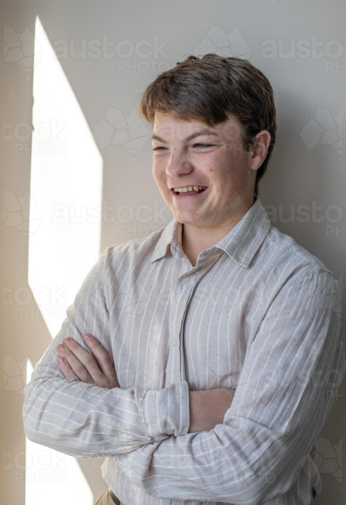 Portrait of a young man in shirt laughing - Australian Stock Image
