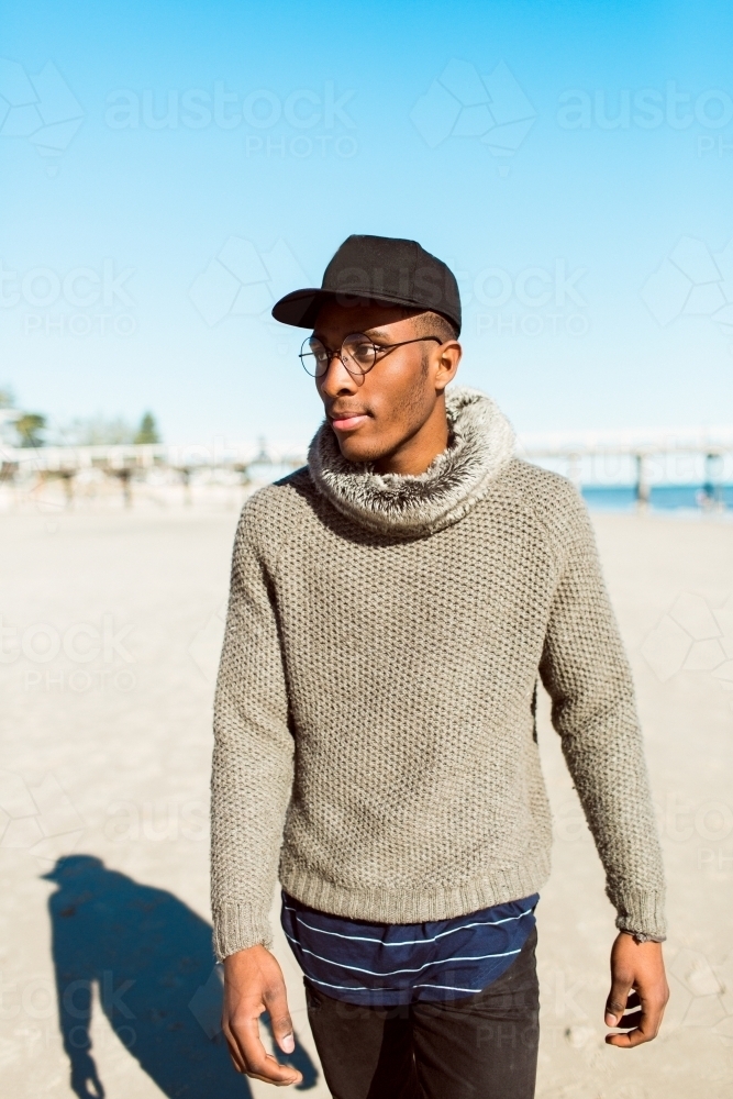 Portrait of a young man standing on the beach - Australian Stock Image