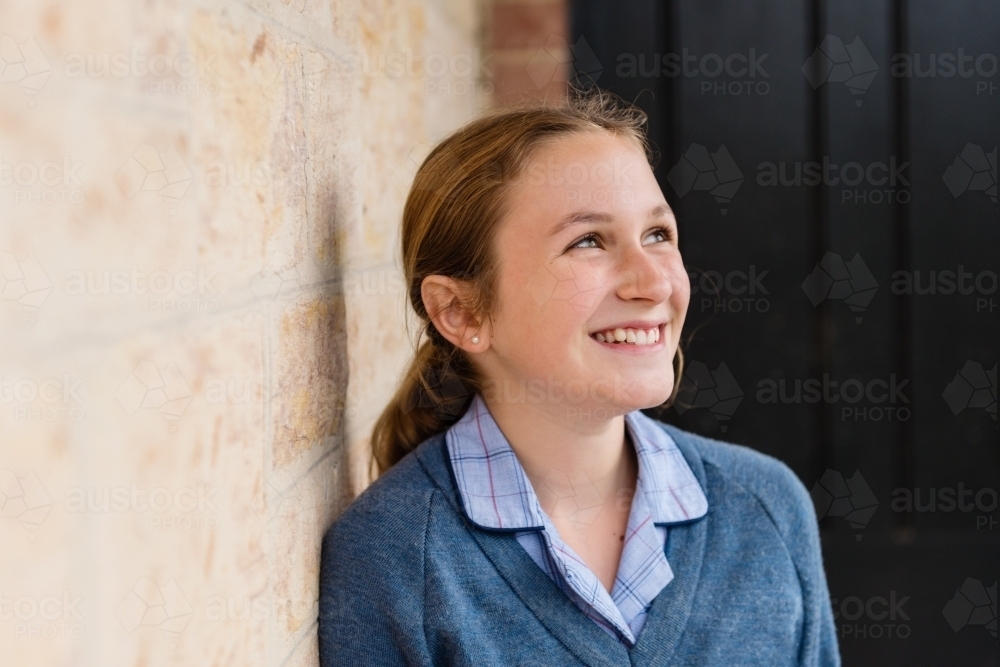portrait of a young teen in school uniform, with copyspace - Australian Stock Image