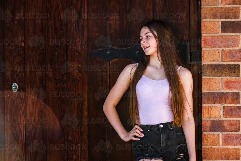 Portrait of a young teen looking to the side - Australian Stock Image