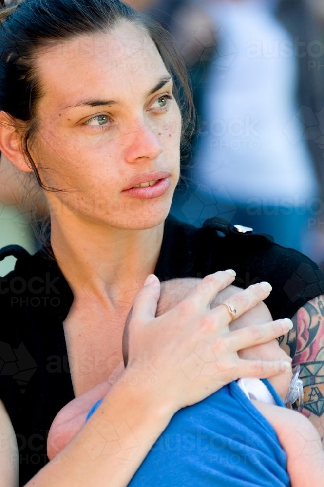 Portrait of Aboriginal Woman with Baby - Australian Stock Image
