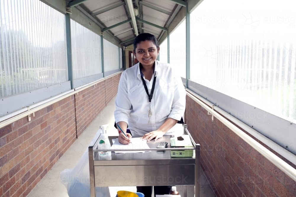 Portrait of asian nurse doing rounds at a regional nursing home - Australian Stock Image