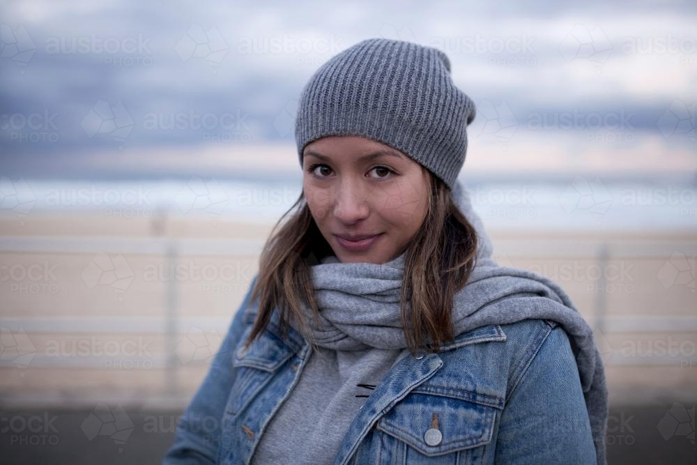 Portrait of eurasian woman at the beach - Australian Stock Image