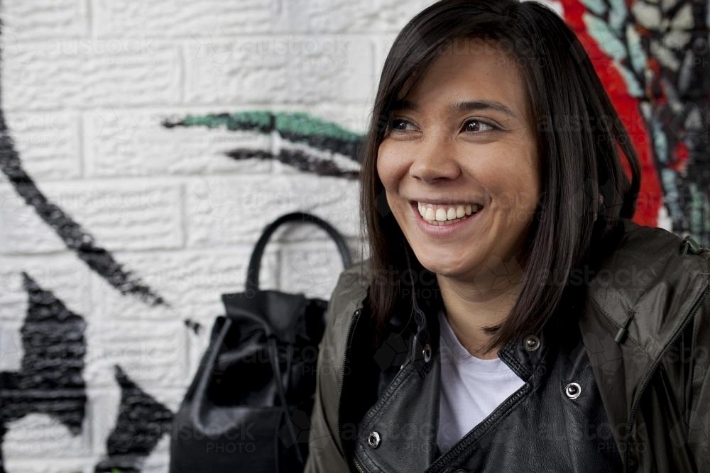 Portrait of eurasian woman laughing - Australian Stock Image