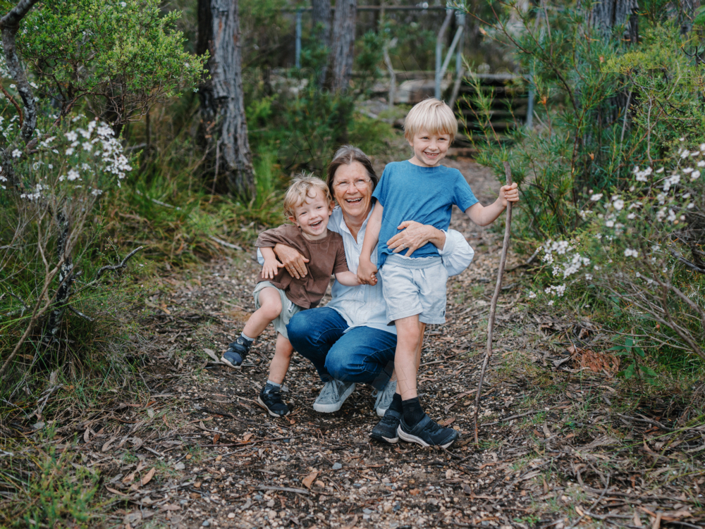 portrait of Grandmother enjoying Australian Bushland with her Grandchildren - Australian Stock Image