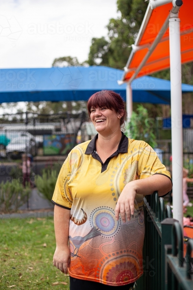 Portrait of happy confident female preschool teacher - Australian Stock Image