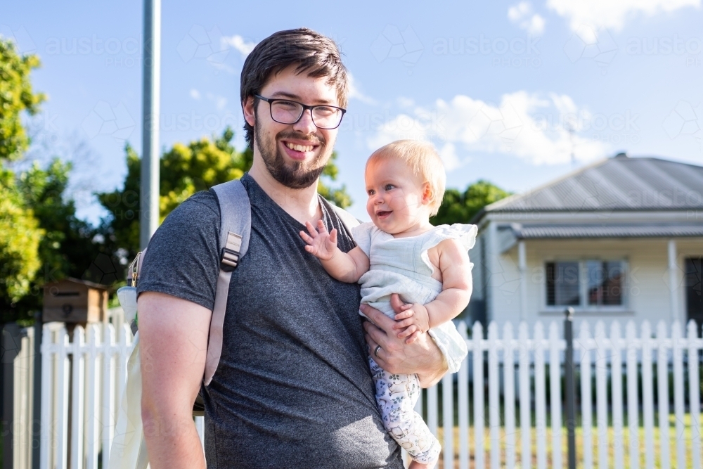 Image of Portrait of happy father with daughter outside of house with ...