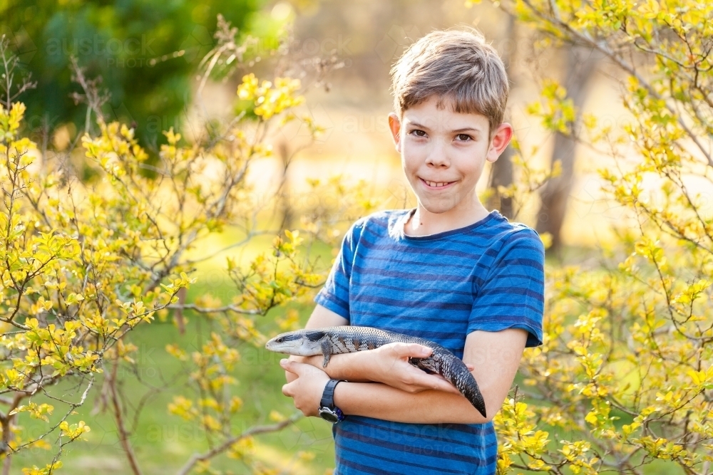 Boy Spring Drugs Image of Portrait of happy tween boy with lizard outside in spring ...