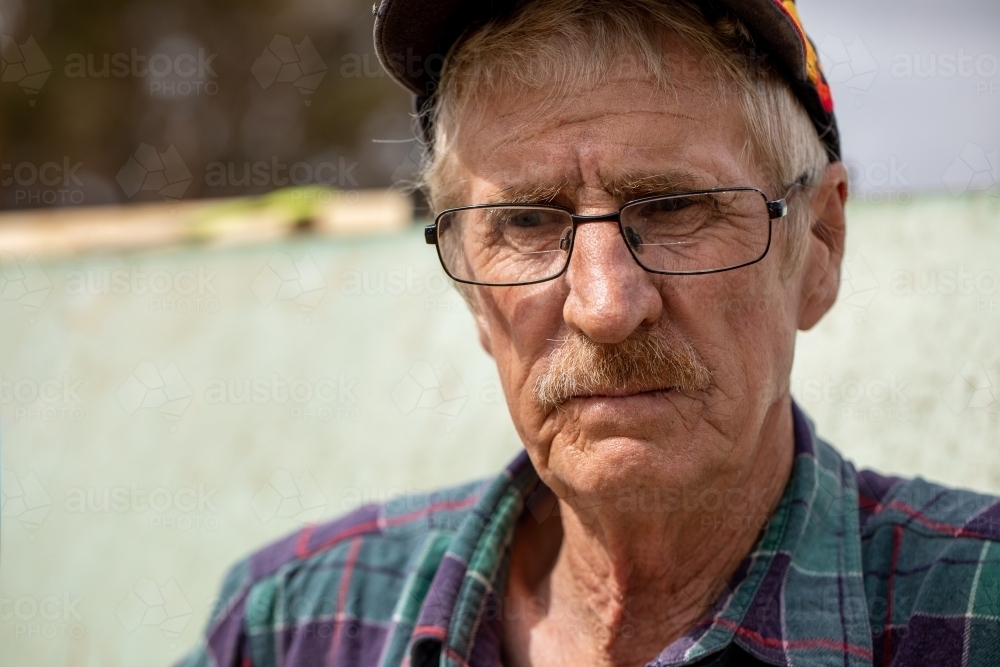 portrait of man in his sixties who works outdoors on the land - Australian Stock Image