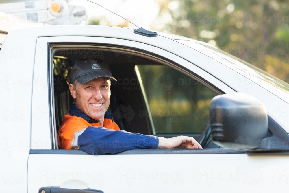 portrait of middle aged aussie man in work ute - Australian Stock Image