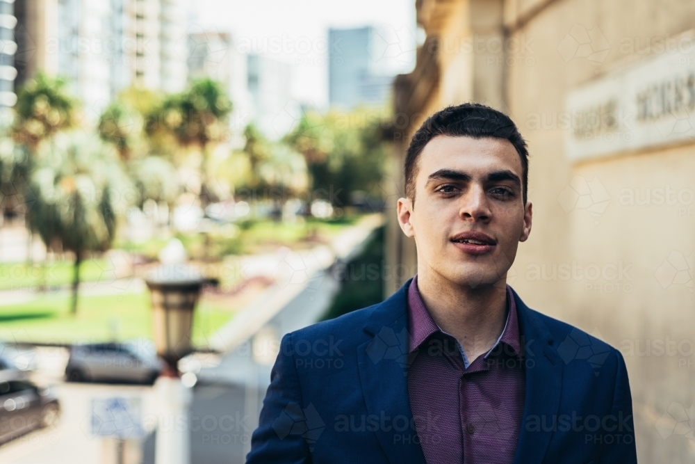 portrait of mixed race young man in the city - Australian Stock Image