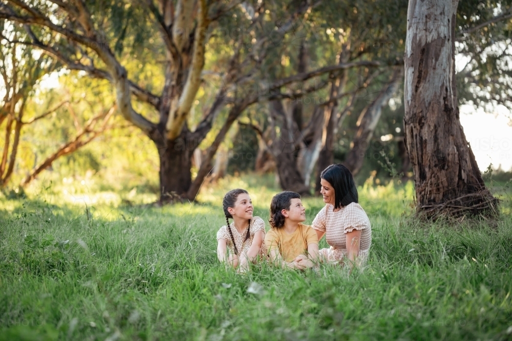Image of Portrait of mother and children sitting together in Australian ...