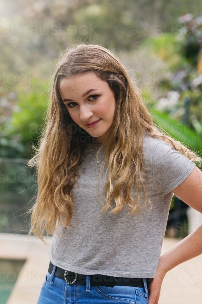 portrait of pretty teen in jeans and tee-shirt - Australian Stock Image