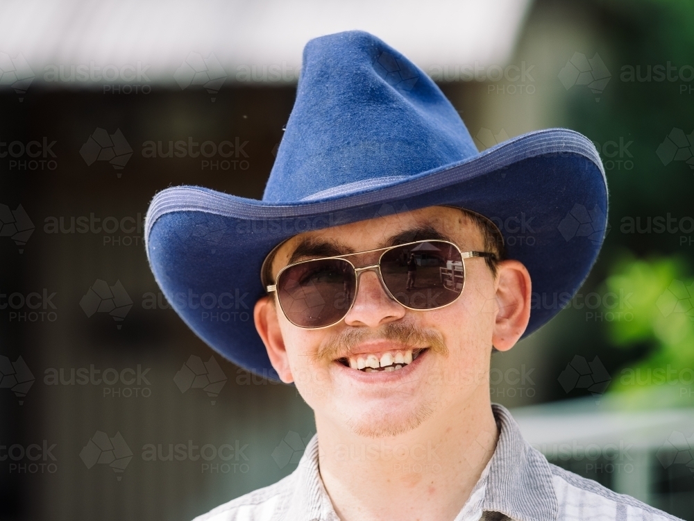 Portrait of Stockman with a Blue Hat Looking at Camera - Australian Stock Image