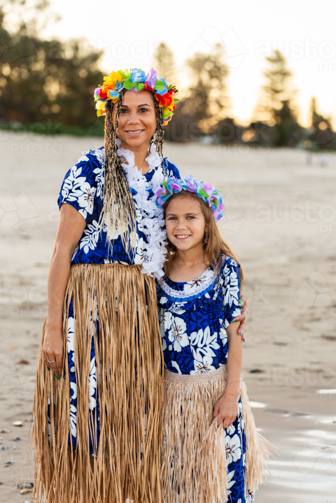 Portrait of Torres Strait Islander girl and mother in traditional dancer floral dress and garland - Australian Stock Image