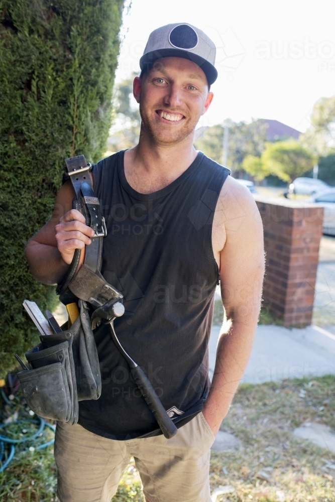 Portrait of tradesman smiling - Australian Stock Image
