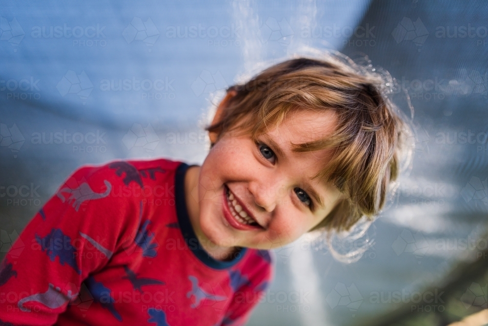 Portrait of young boy smiling - Australian Stock Image