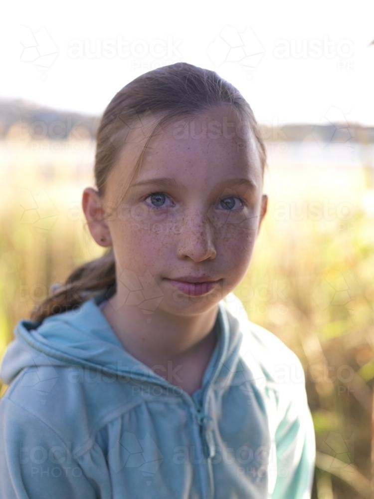 Portrait of young girl with freckles - Australian Stock Image