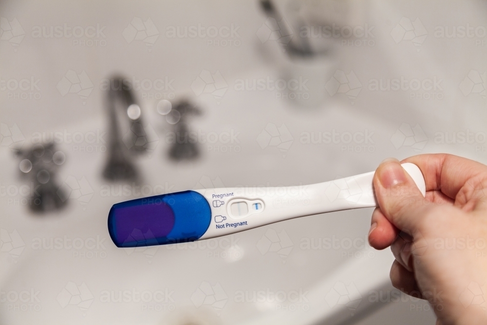 Positive pregnancy test showing blue line - Australian Stock Image