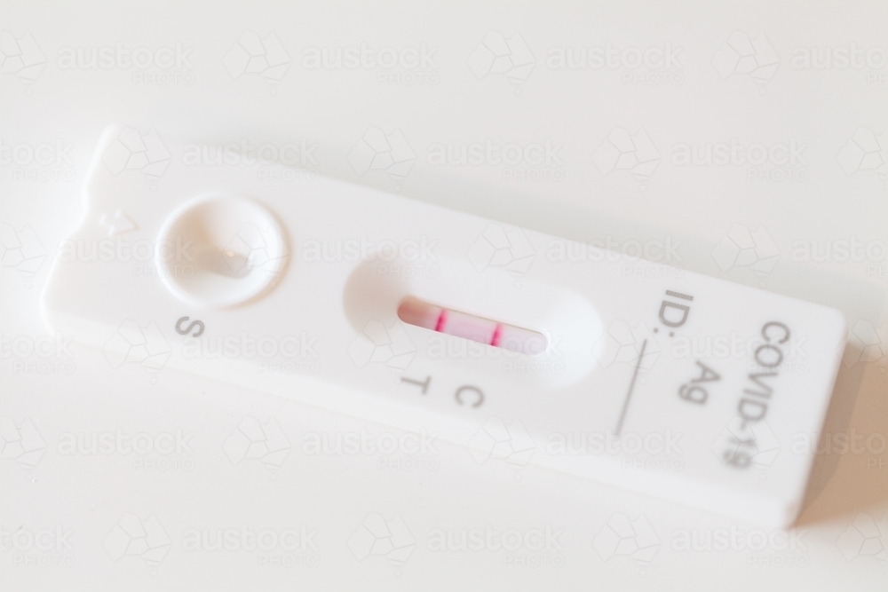 Positive RAT covid test on white - Australian Stock Image