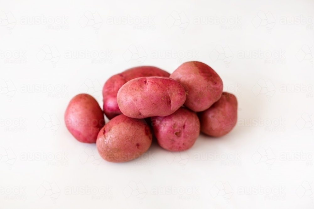 Potatoes on white backdrop - Australian Stock Image