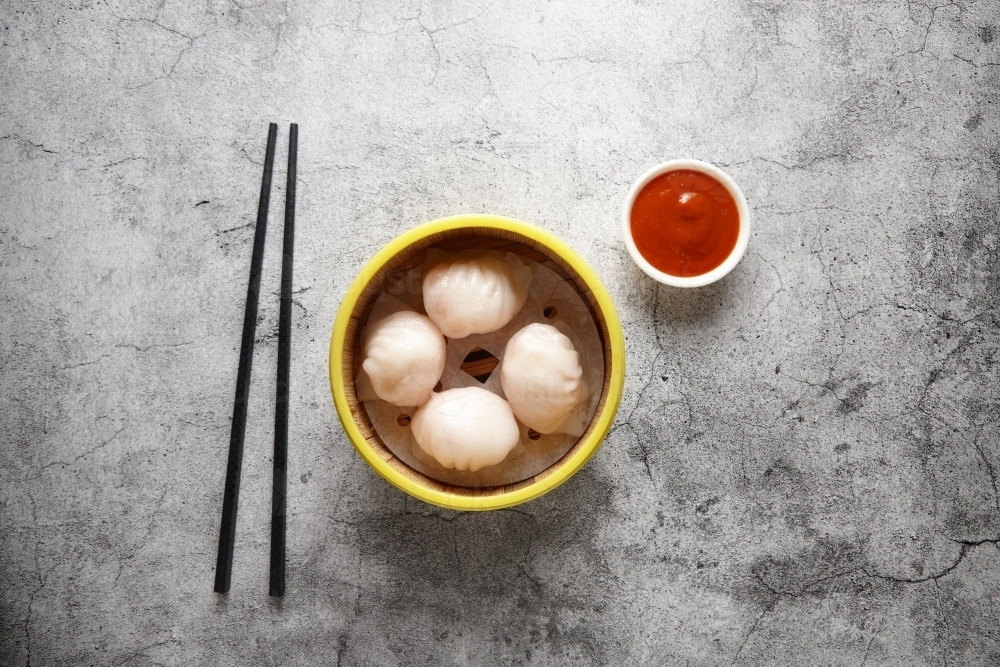 Prawn dumpling dish on table - Australian Stock Image