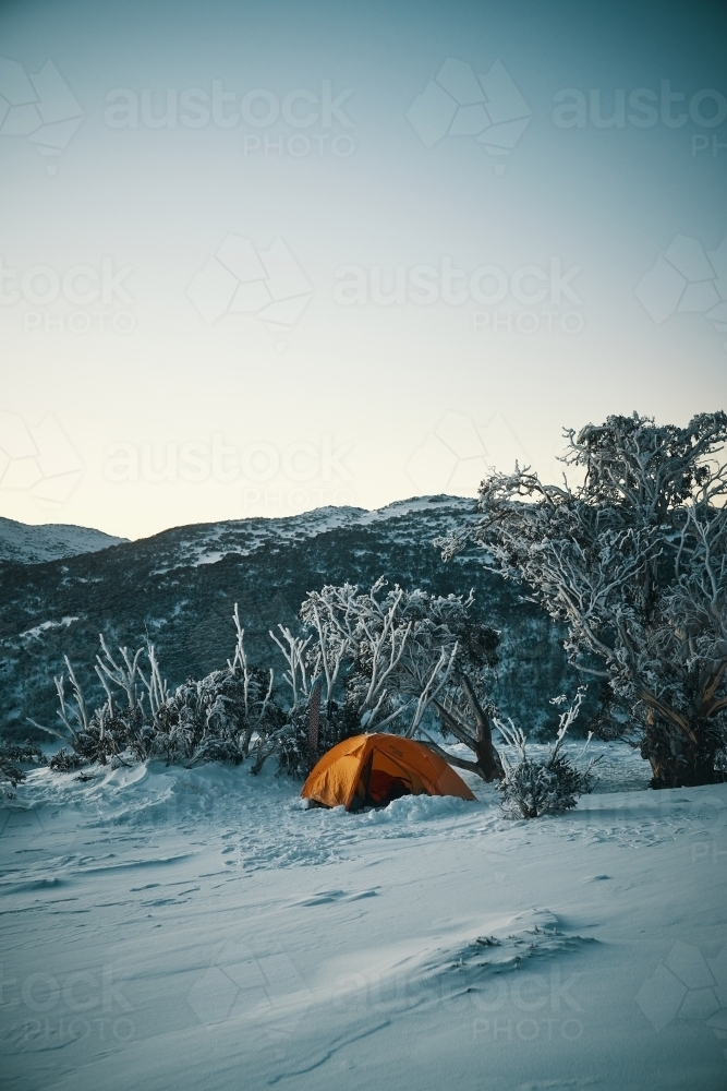 Pre-dawn light on snow camp in the snowy mountains - Australian Stock Image