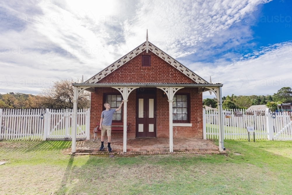 Pre-teen boy exploring historic building in the gold mining town of Hill End - Australian Stock Image