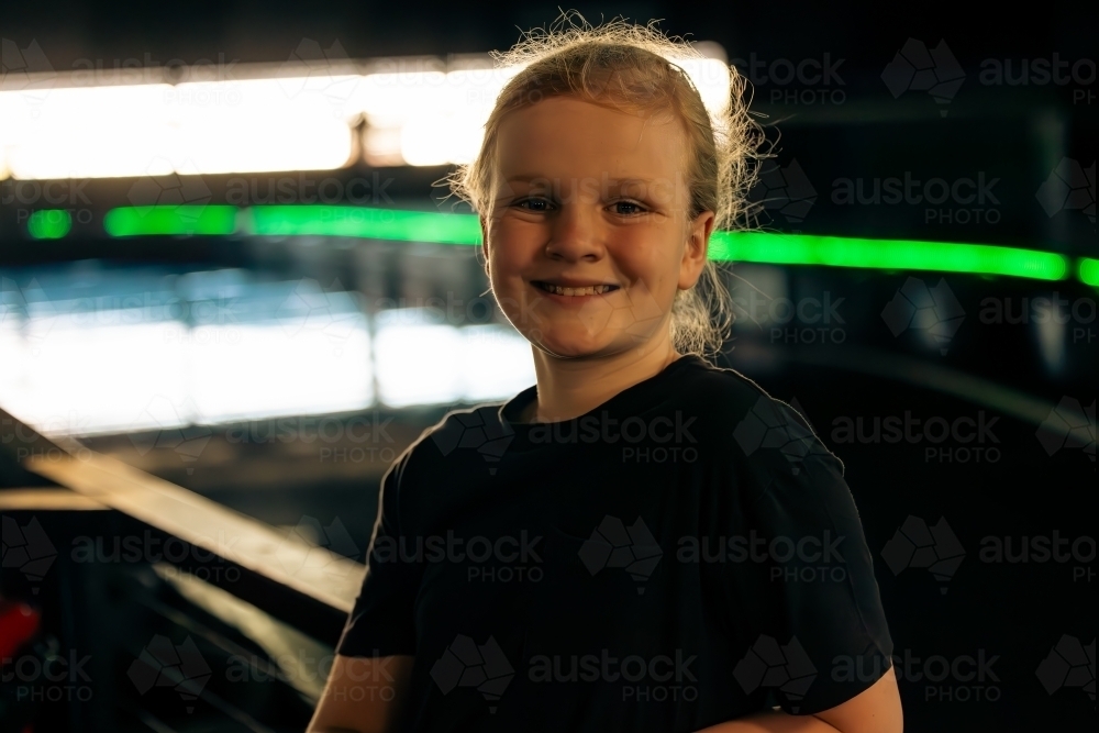 Pre-teen boy hanging out at indoor Go Kart track - Australian Stock Image