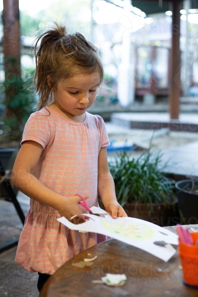 Preschool girl doing craft - Australian Stock Image