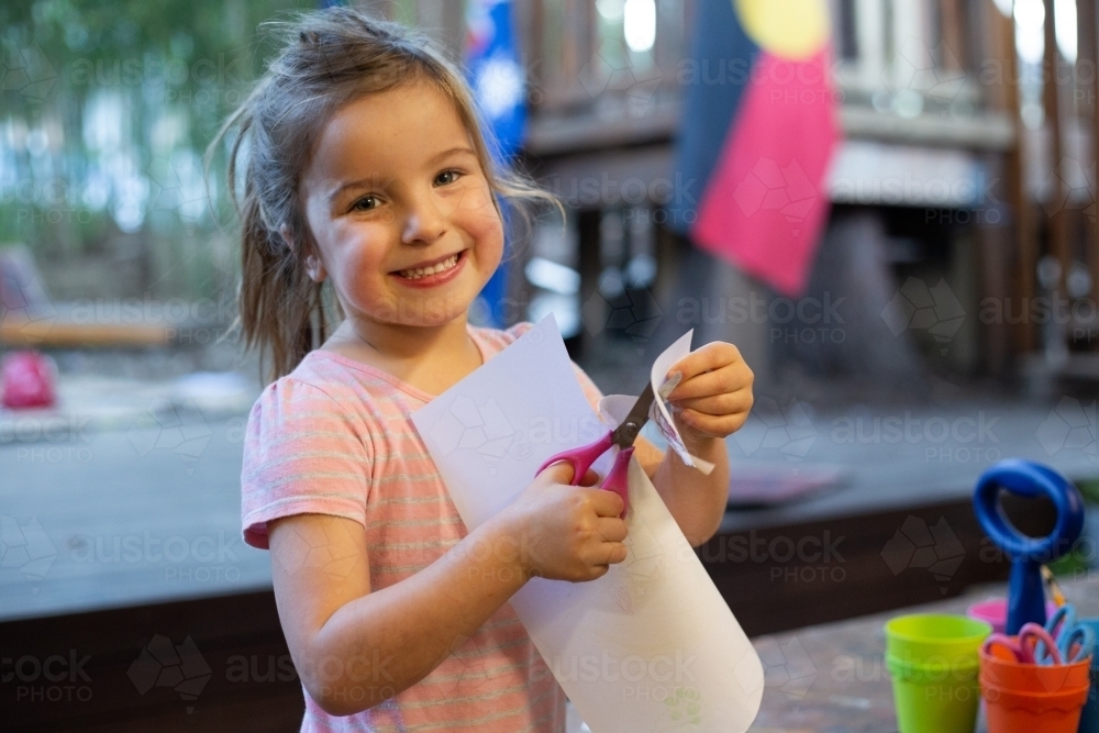 Preschool girl doing craft - Australian Stock Image