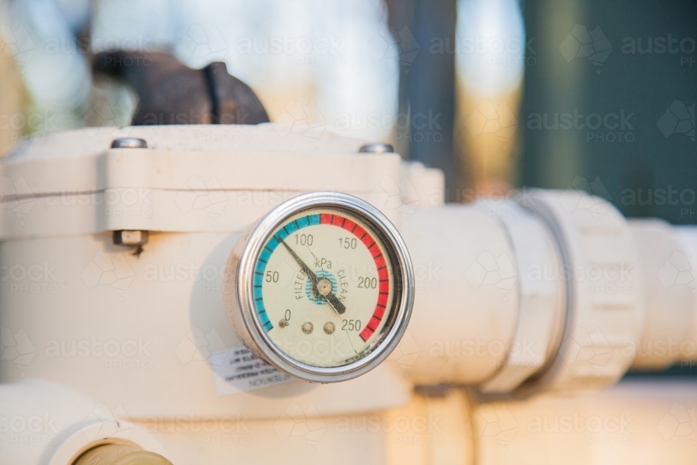 Image of Pressure gauge on old pool pump sand filter Austockphoto