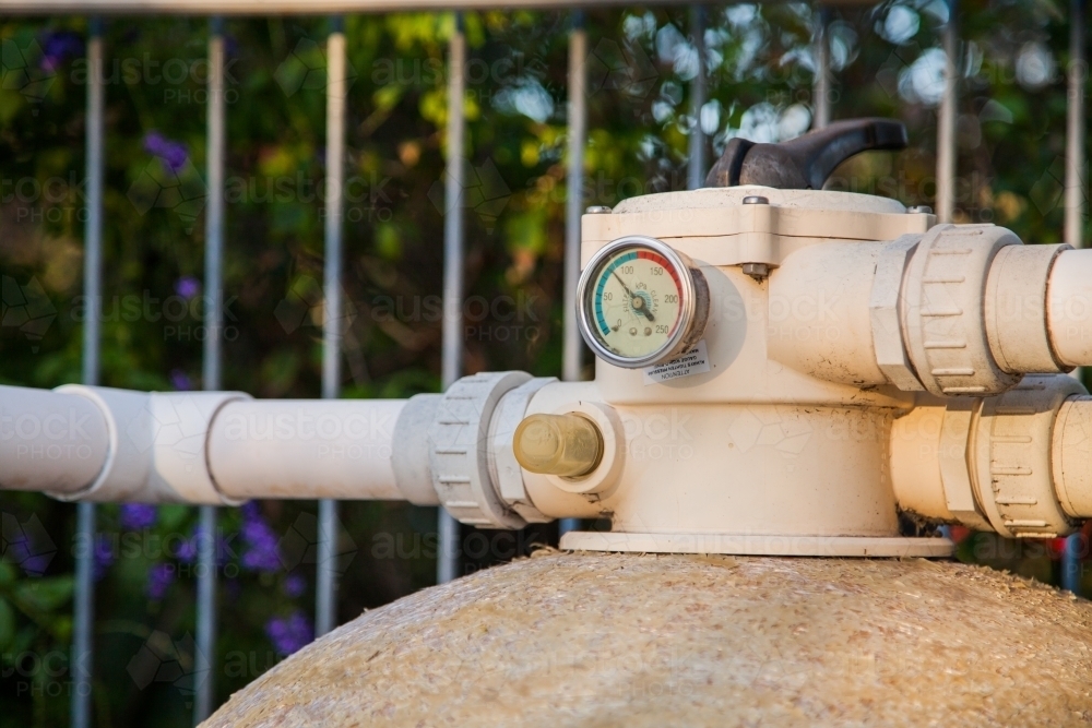Pressure gauge on old pool pump sand filter - Australian Stock Image