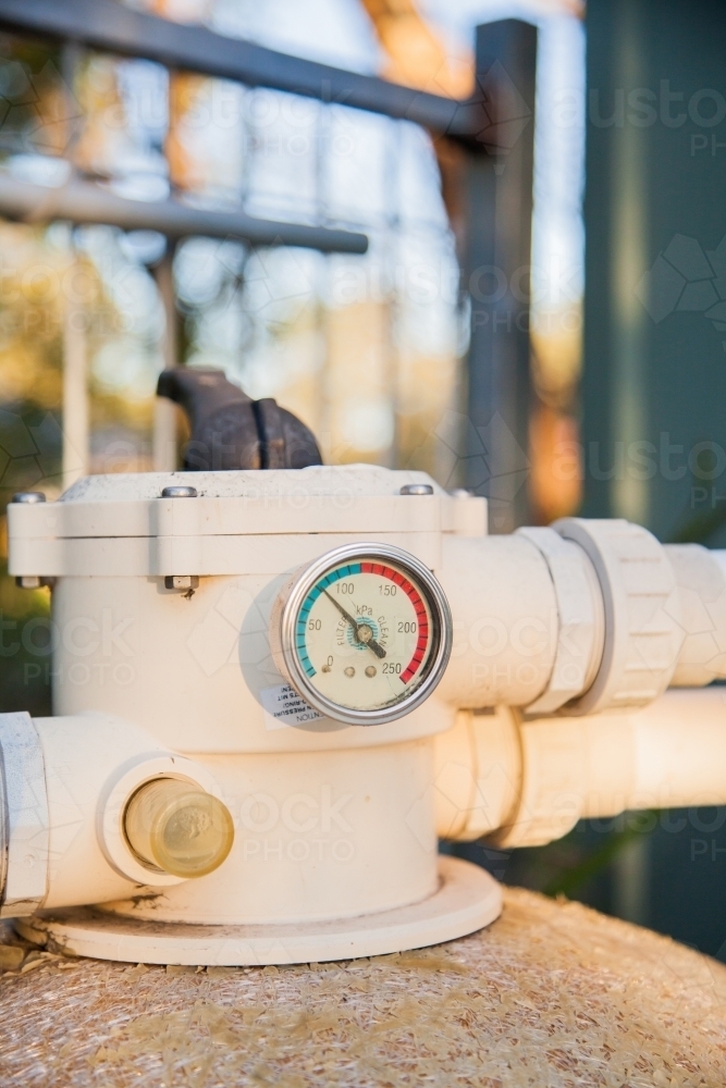 Image of Pressure gauge on old pool pump sand filter Austockphoto
