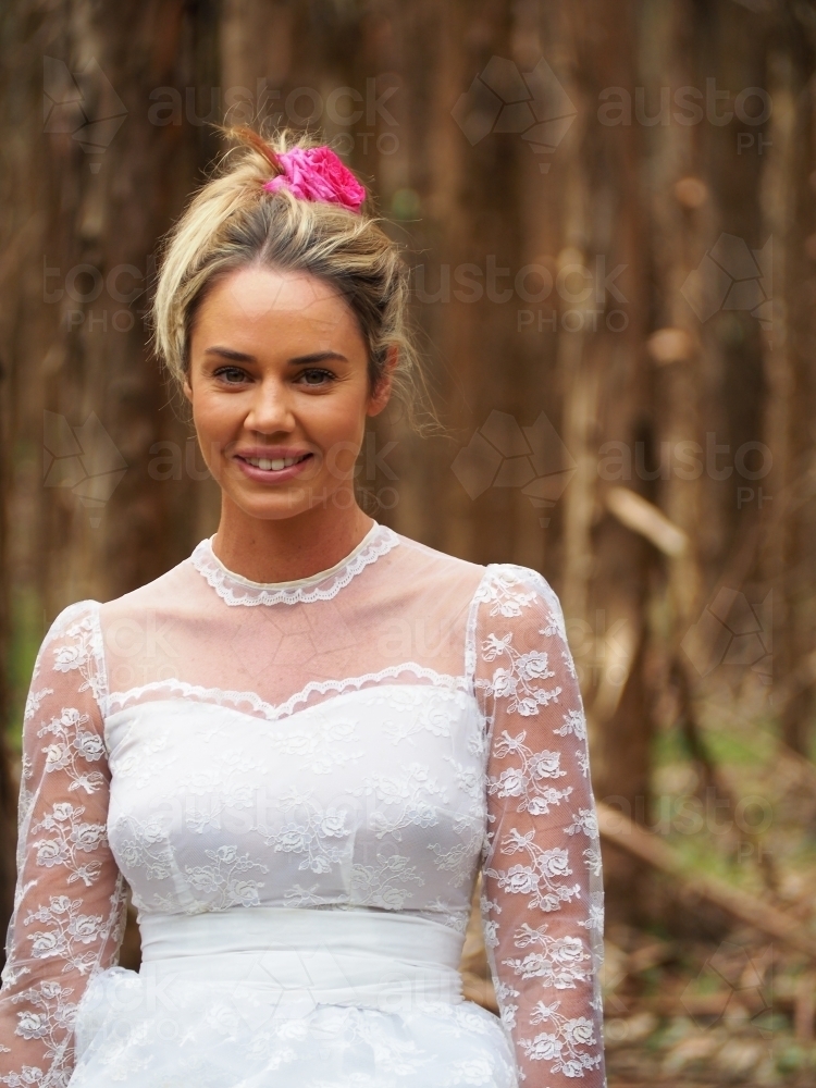 Pretty girl smiling in a vintage wedding dress - Australian Stock Image