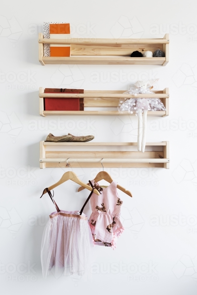 Pretty toys shelf storage in a young girls bedroom - Australian Stock Image