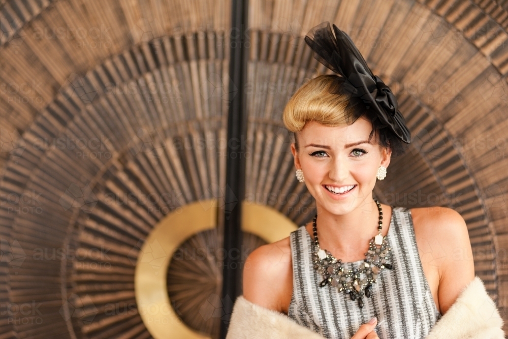 pretty young woman dressed up for race day or a special event - Australian Stock Image