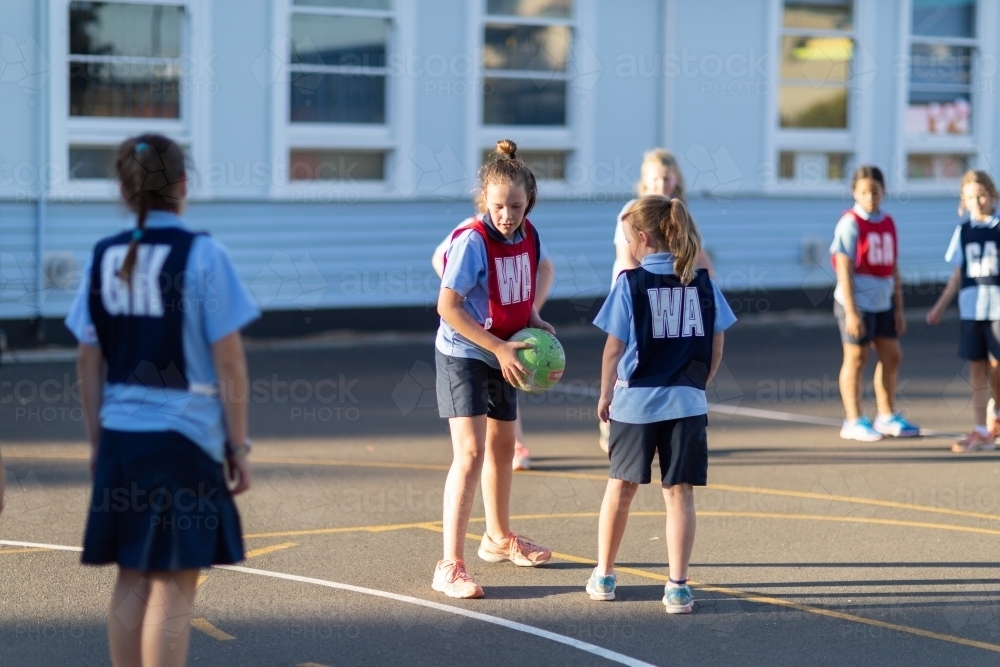 Primary school netball team training - Australian Stock Image
