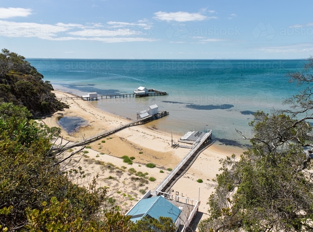 private jetties & boat sheds from cliffside walk - Australian Stock Image