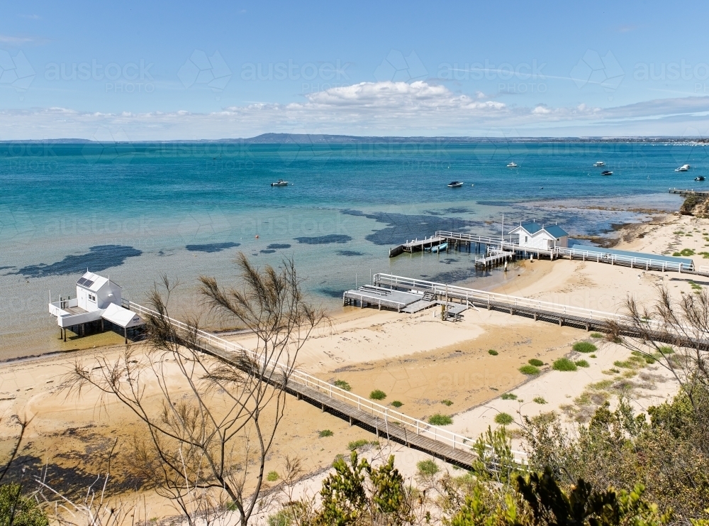 private jetties & boat sheds from cliffside walk - Australian Stock Image